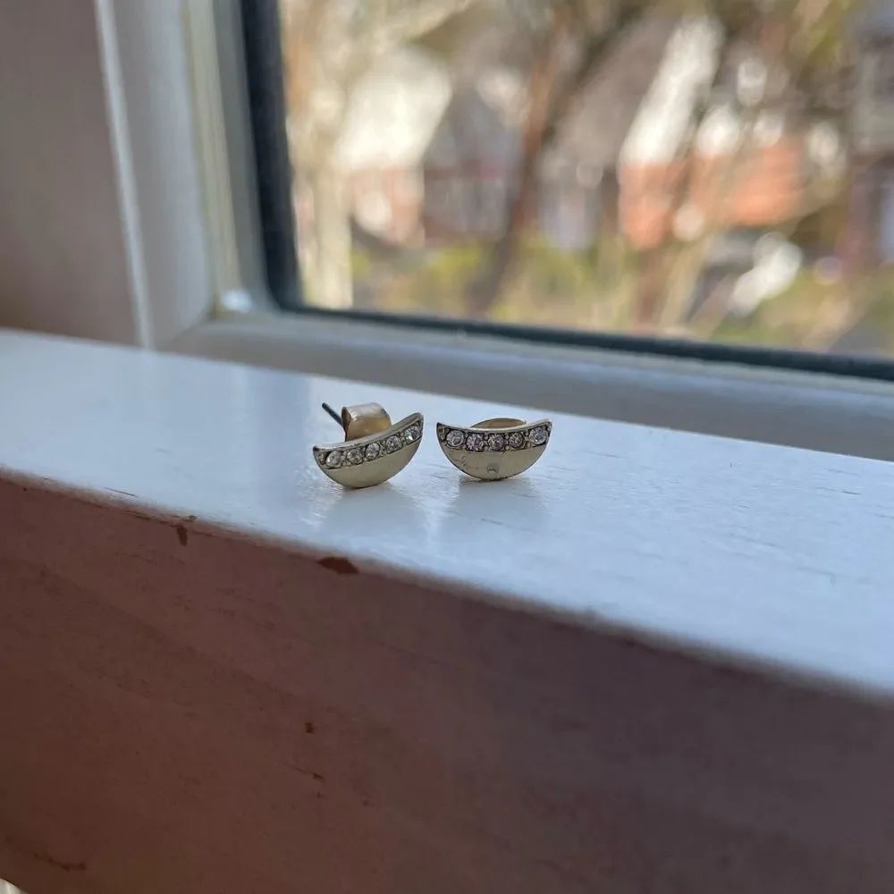 Beautiful crescent shaped gold colored earrings